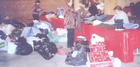 Volunteers at an Armenian center gathering clothing for the ARS relief efforts