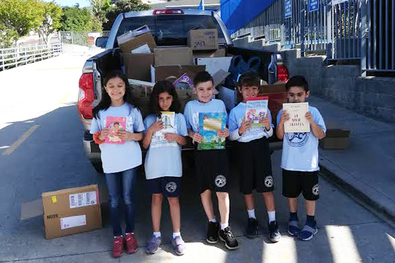 Vahan & Anoush Chamlian Armenian School students donating books to Shirvanian Youth Center, Gyumri and kindergarten and day school in Nanulik. 