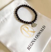 The bracelet is set with a sterling silver charm molded from an authentic ancient Armenian coin