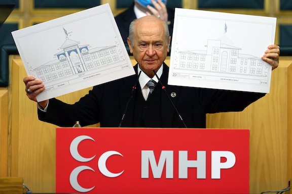 Nationalist Movement Party (MHP) Chairperson Devlet Bahçeli during his party's parliamentary group meeting in Ankara shows the plans of the school to be built in Shushi, Jan. 26, 2021. (Anadolu Agence Photo)