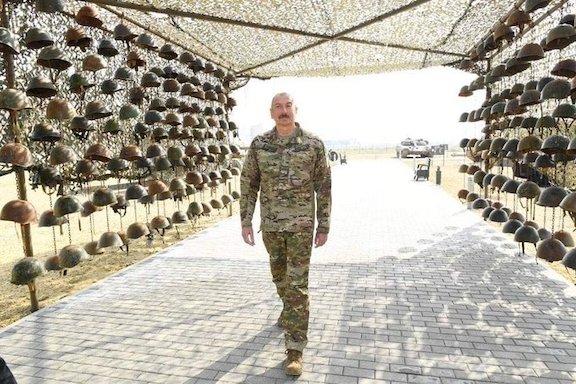 Azerbaijani President Ilham Aliyev strolls into the "Military Trophies Park" on April 12